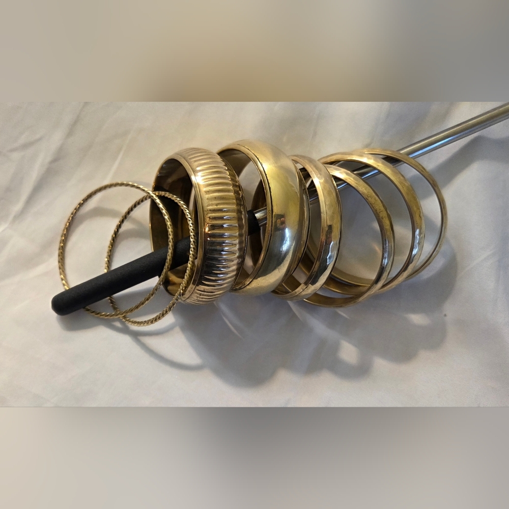 Eight Brass Bracelets